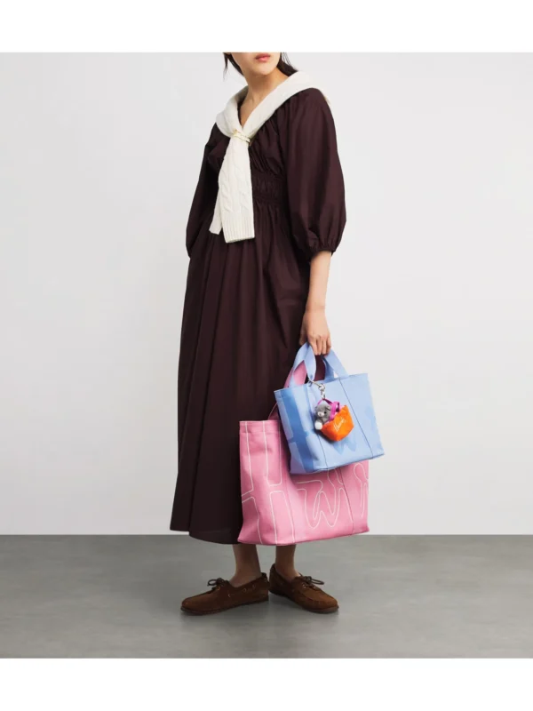 精品休閒帆布包手提效果示意，適合夏日度假穿搭 (粉紅)