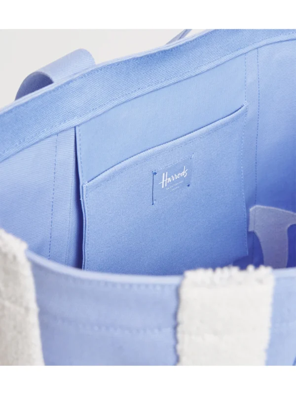 Harrods 帆布包內部大容量空間與實用內置插袋，適合通勤與購物